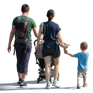 backlit family of three walking