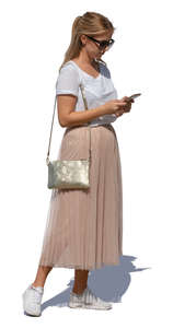 woman standing and checking her phone