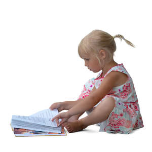 little girl sitting and reading a book