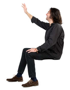 man sitting and waving