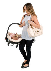 mother carrying her baby in a baby car seat