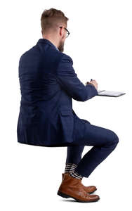 businessman sitting and writing notes