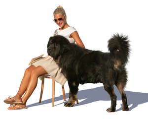 woman sitting and petting her dog