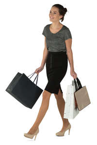 young smiling woman walking with many shopping bags