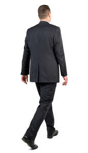 man in a black suit walking