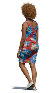 black woman in a summer dress walking