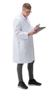 young doctor standing and writing
