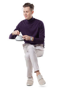 young man sitting and drinking coffee