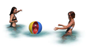 two women playing beach ball in the pool