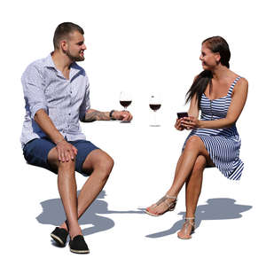 man and woman sitting in an outdoor cafe