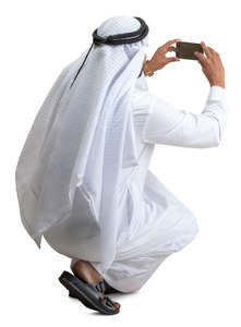 muslim man taking a picture