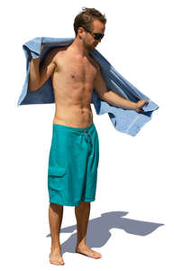 man drying himself at the beach