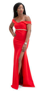 black woman in a red evening gown standing