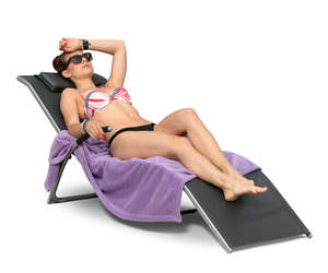 woman sunbathing on a beach chair