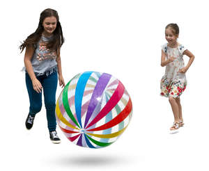 two girls playing with a beach ball