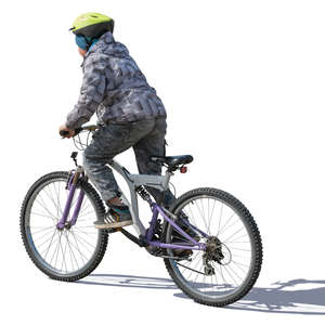 boy riding a bike in autumn