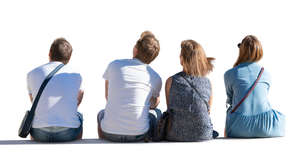 four people sitting seen from behind