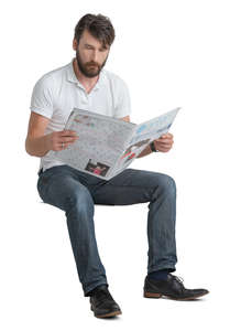 man sitting and reading a newspaper