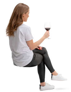 woman sitting and drinking wine