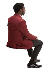 black man in a suit sitting