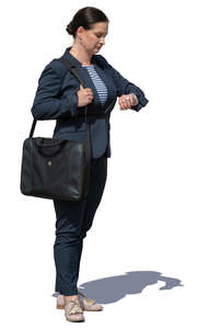 businesswoman standing and checking her watch