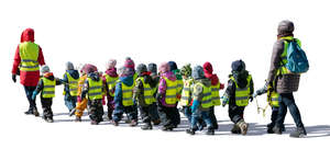 group of kindergarten children walking on the street