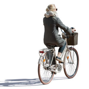 backlit woman riding a bike