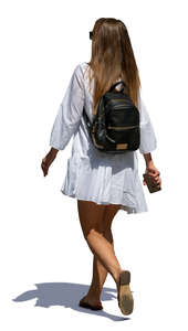 woman in a white summer dress walking