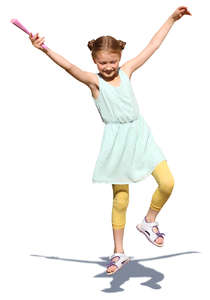 young girl in a summer dress jumping in the air