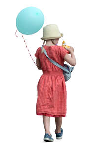 little girl with a balloon walking