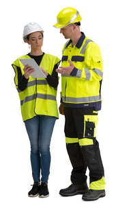 man and woman talking at a construction site