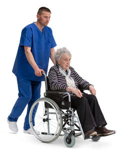 nurse pushing a woman in a wheelchair