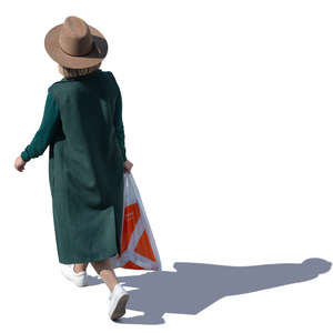 woman with a hat and overcoat walking seen from above