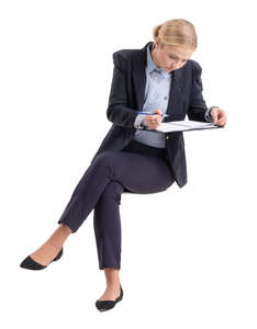 businesswoman sitting and writing notes