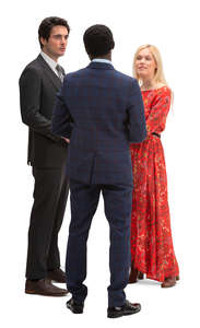 group of three people standing and talking