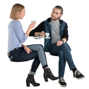 man and woman sitting and drinking coffee
