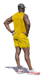 african man in a yellow costume standing