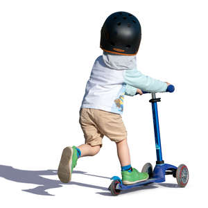 little boy riding a scooter