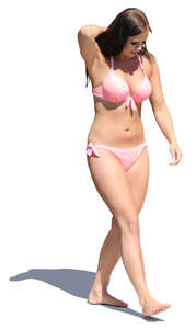 woman in a pink bikini walking 