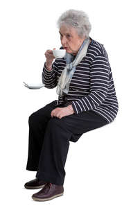 older woman sitting in a cafe