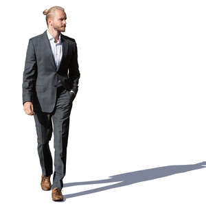 young man in a suit walking