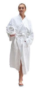 woman in a white bathrobe walking