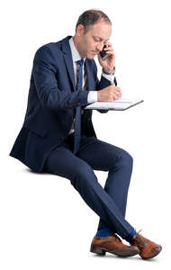 businessman sitting and taking notes