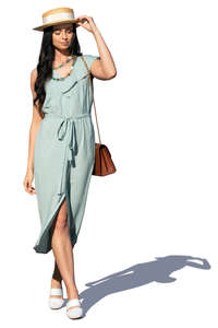 woman in a pale blue summer dress walking