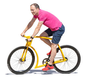 man riding a yellow bike