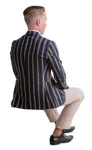 man in a striped jacket sitting