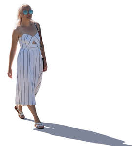 backlit woman walking