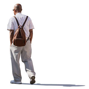 backlit older man walking