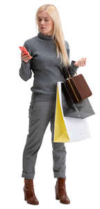 woman with many shopping bags standing