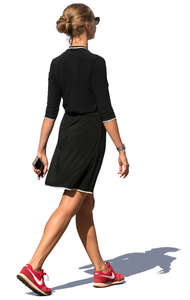 woman in a black summer dress walking